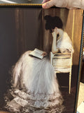 woman in white reading picture
